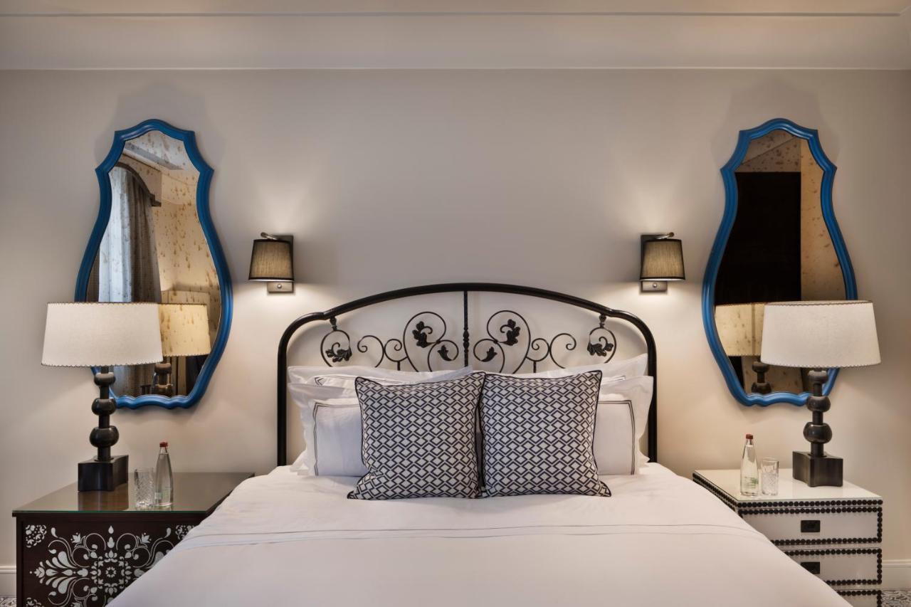 Orient By Isrotel Exclusive Jerusalem Exterior foto A bedroom at the Hotel de Ville